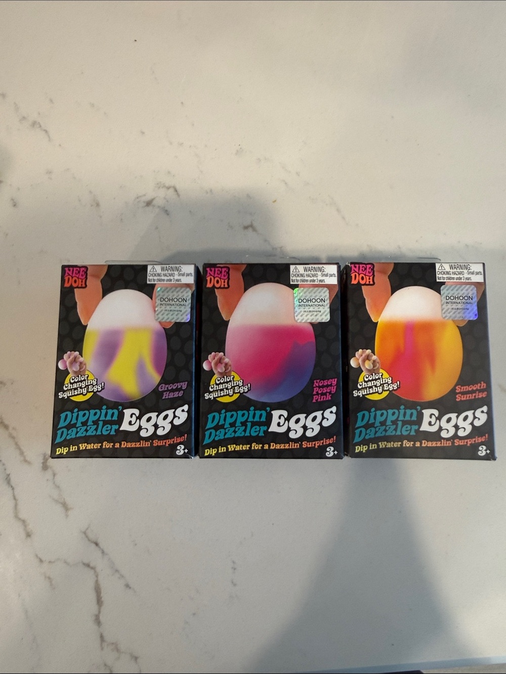 NeeDoh Dippin' Dazzler Eggs Color-Changing Squishy Eggs - Purple, Pink, Orange